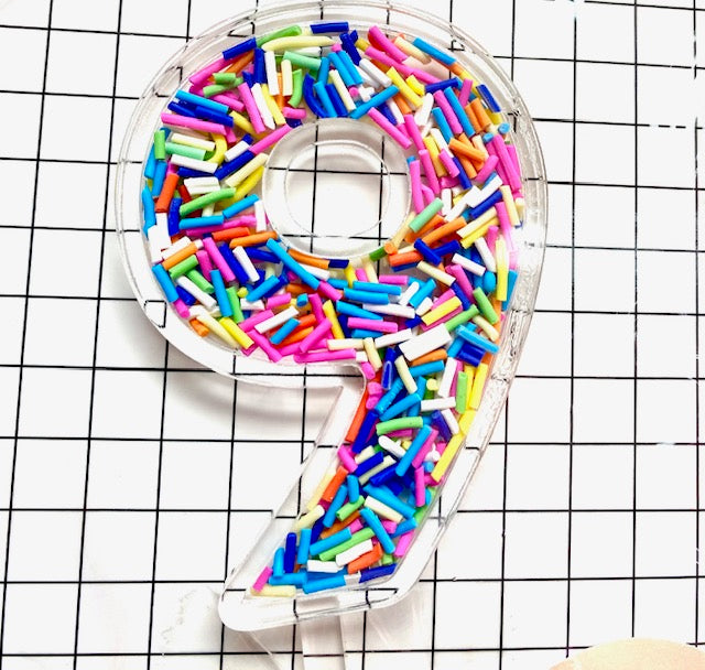 Sprinkle filled number cake toppers